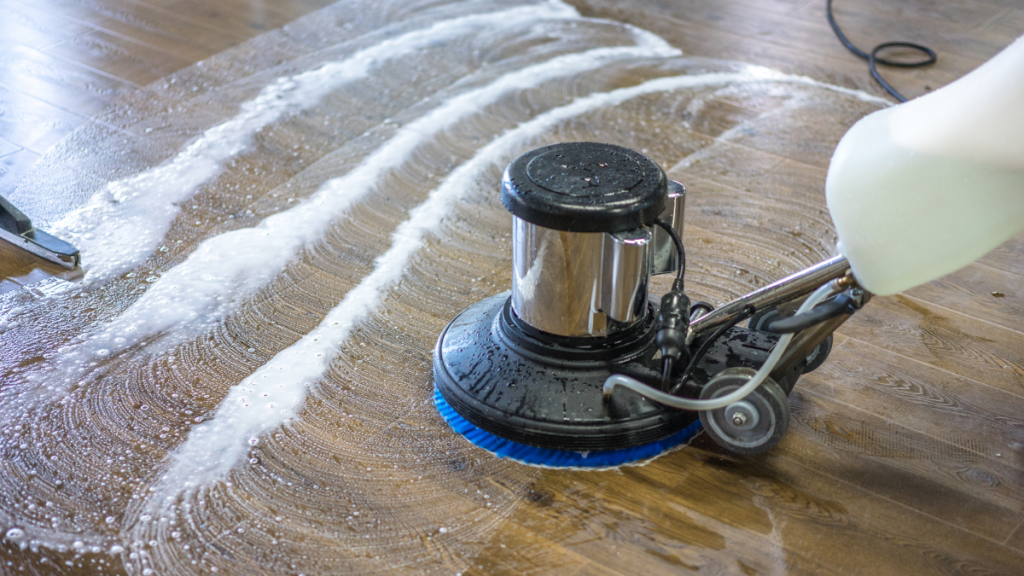  Floor cleaning machine scrubbing a hard floor surface